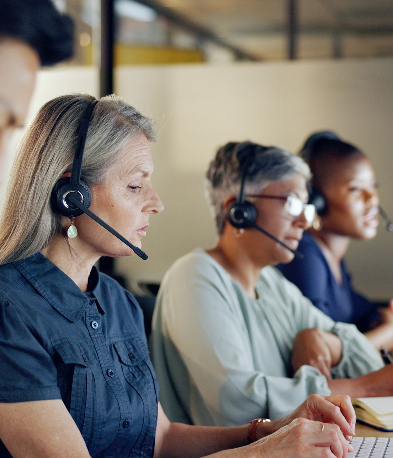 A call centre of people taking calls